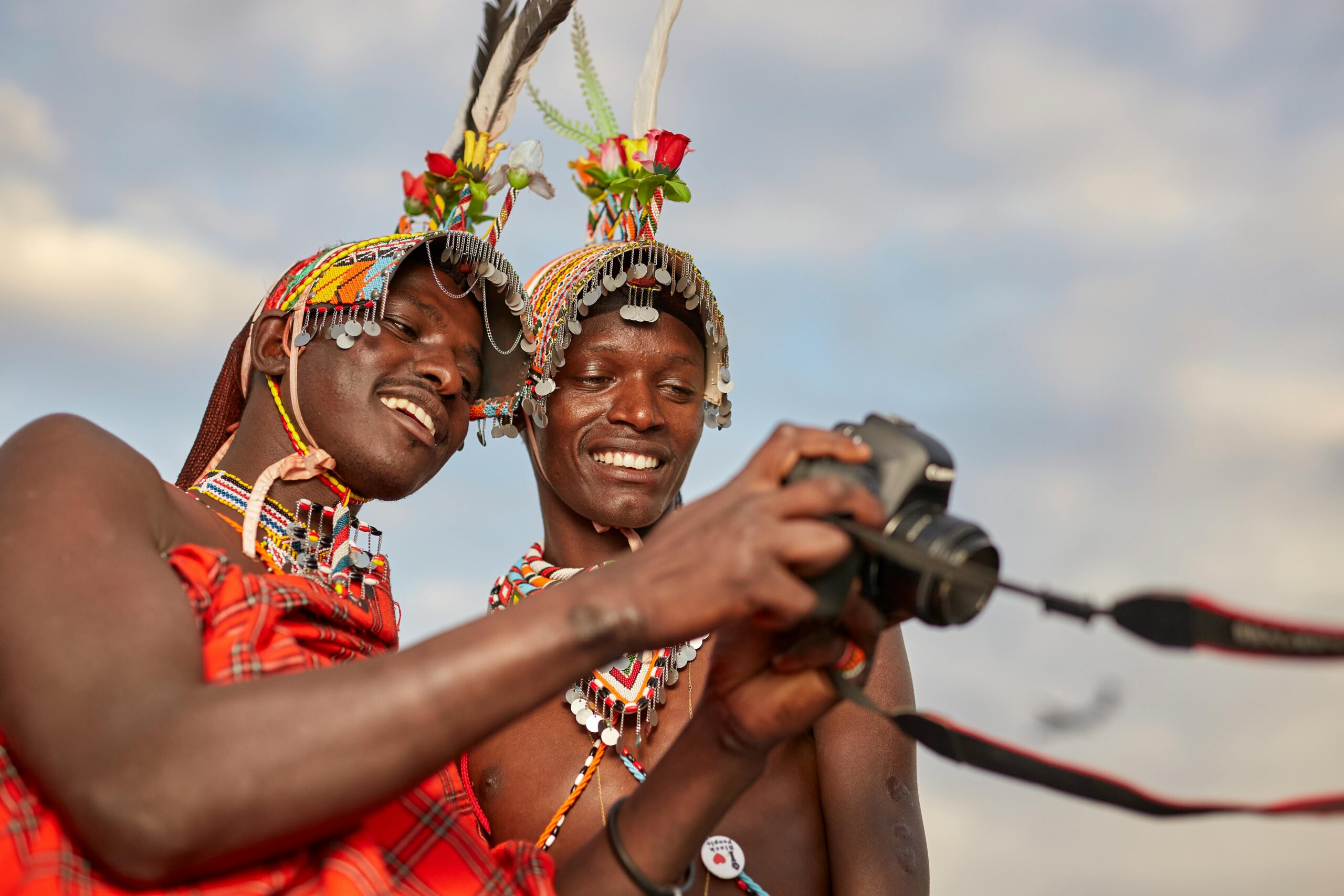 Maasai community sharing cultural traditions at sunset